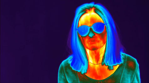 A still from Weed Killer by Patrick Staff. A thermogram of a person with glasses and long hair down to the shoulders 