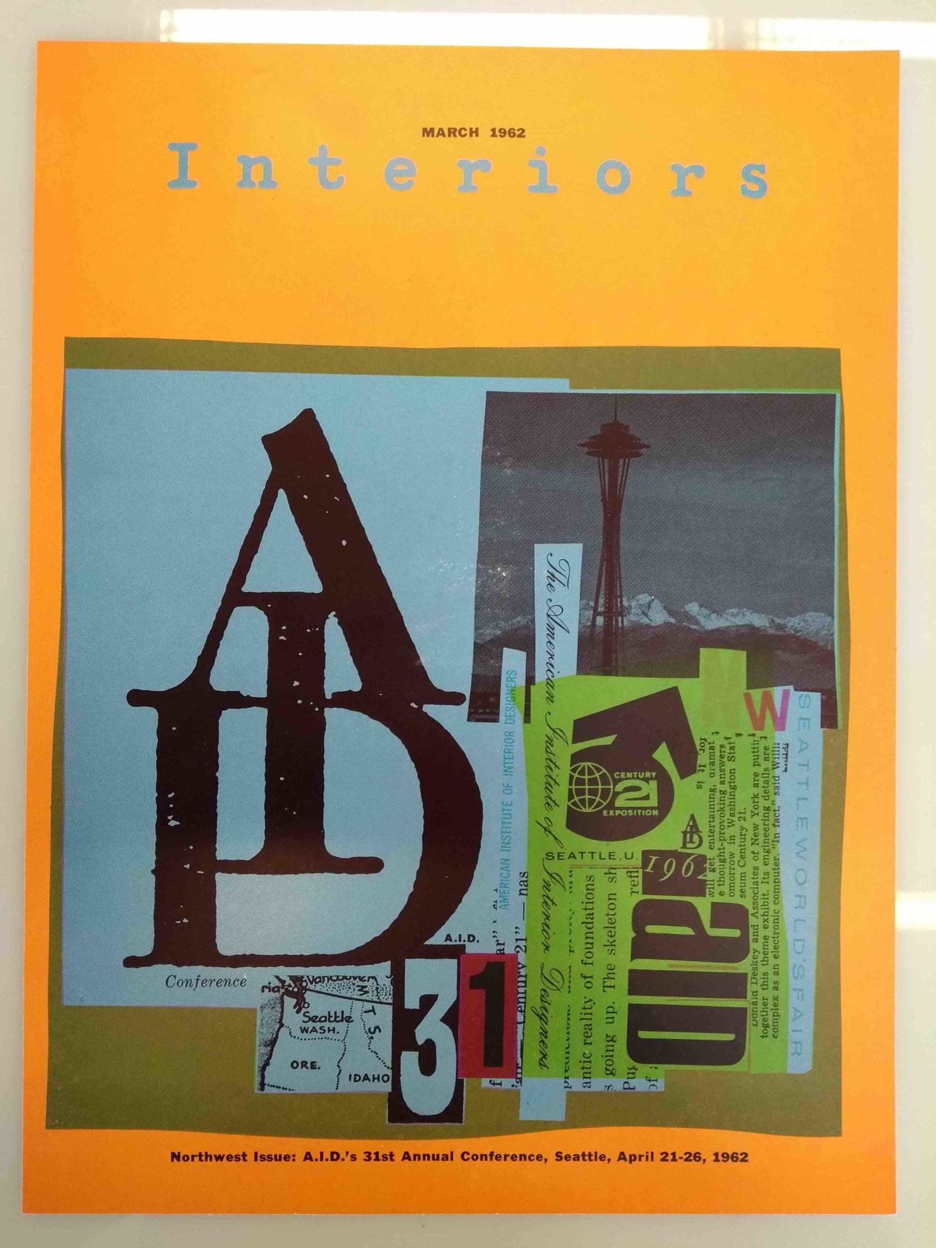 A book cover has a collage of letter prints, a photograph of a tower, newspaper clippings and a map of Seattle. On the top it writes “march 1962 Interiors” 