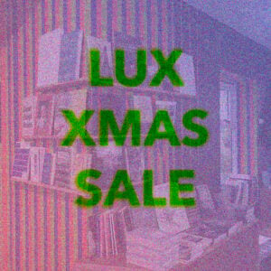 green transluscent text LUX XMAS SALE overlays a pink filtered image of a bookshop whose walls are painted in strips and decorated with book displays.