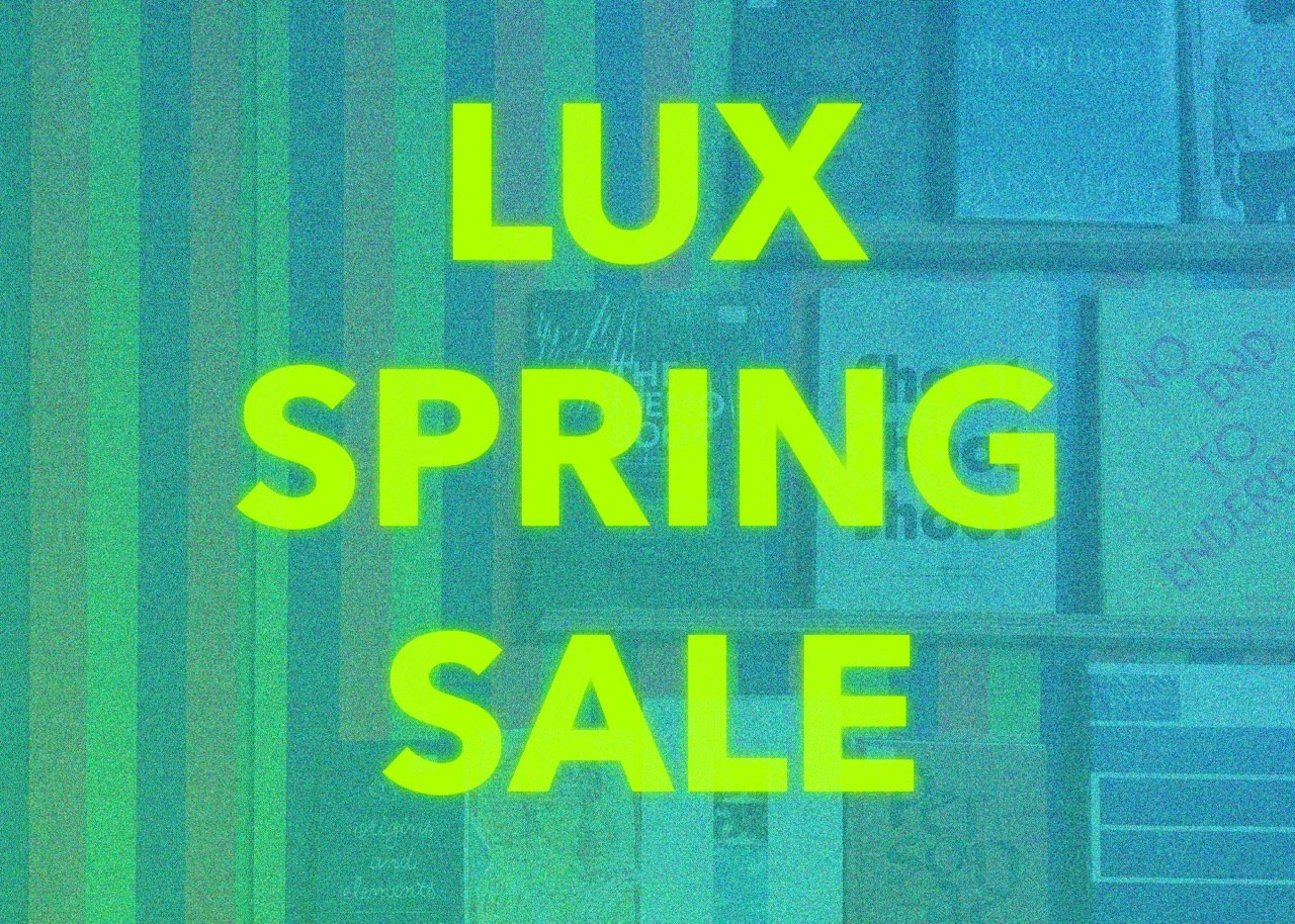 Large caption in yellow green reads “ LUX SPRING SALE” against a grainy blue tinted image of a stripe-patterned wall with a book display