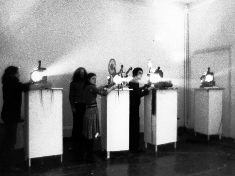 Filmaktion performance at Gallery House, London, March 1973. At the projectors: Malcolm Le Grice, Gill Eatherley, William Raban. Photograph by David Crosswaite.
